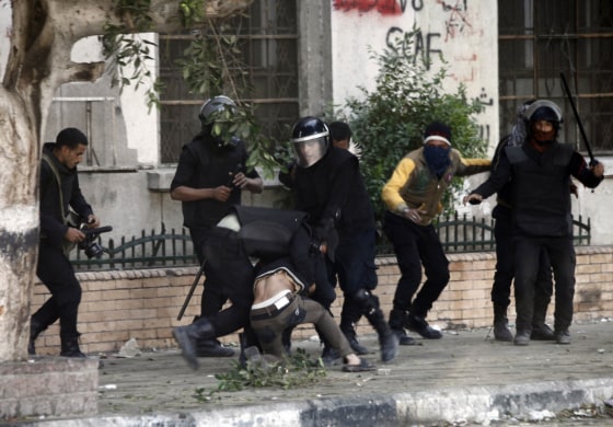 Egyptian riot police detain a man during clashes on Omar Makram street, off Tahrir Square, on Nov. 28 in Cairo.