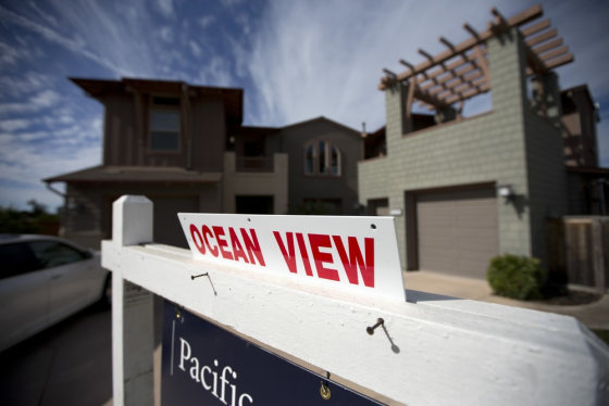 This Wednesday, Nov. 14, 2012, photo, shows a home for sale in Leucadia, Calif. Mortgage rates hovered near record lows this week, helping to boost ho...