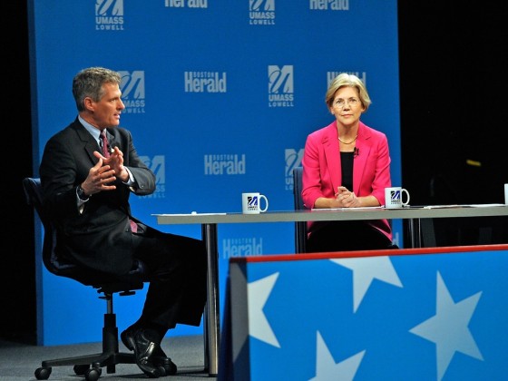 Republican Sen. Scott Brown, left, answers a question during a debate against Democratic challenger Elizabeth Warren, center, sponsored by the Boston Herald at the University of Massachusetts in Lowell, Mass., Monday, Oct. 1, 2012.