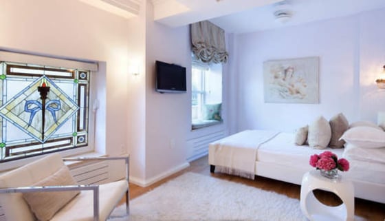 A stained glass window accents one of the bedrooms.