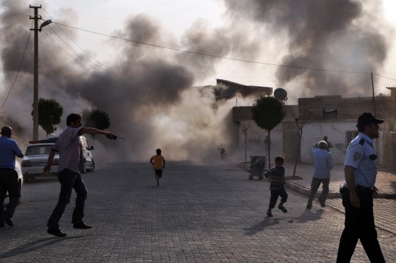 Smoke rises after mortar fire from Syria hit a town in Turkey.