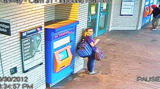 A person believed to be Kara Alongi is seen with a suitcase at a transit station in Rahway, N.J.