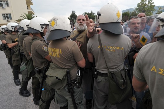 Police clash with shipyard workers near the entrance of the Defence Ministry in Athens on October 4, 2012.