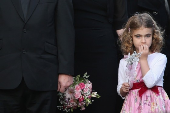 Jessie, the five-year-old daughter of Greater Manchester Police constable Fiona Bone's partner Clare Curran, watches as the coffin of Fiona Bone is taken into Manchester Cathedral for her funeral service on Oct. 4, in Manchester, England.
