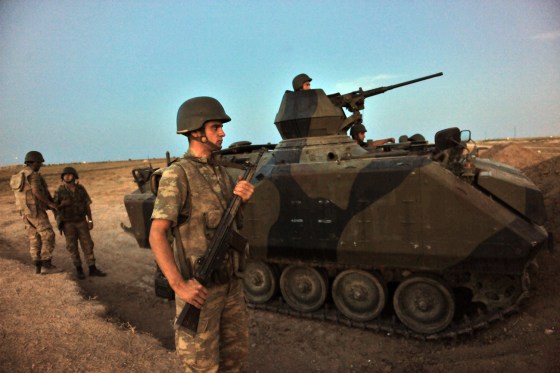 Turkish soldiers stand guard in Akcakale in the southern Sanliurfa province near the Turkish-Syria border, Oct. 4, 2012. Turkish artillery hit targets near Syria's Tel Abyad border town for a second day today, killing several Syrian soldiers according to activists and security sources, after a mortar bomb fired from the area killed five Turkish civilians. Turkey's Prime Minister Recep Tayyip Erdogan said that Turkey has no intention of going to war with Syria, hours after parliament authorized possible cross-border attacks.