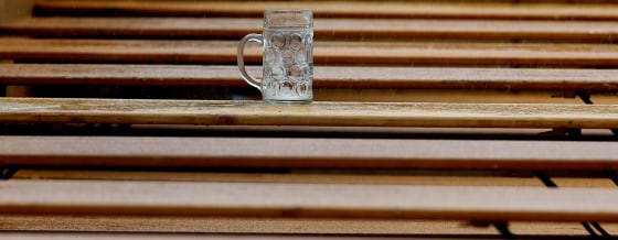 An empty beer mug stands on a table at the last day of the famous Bavarian