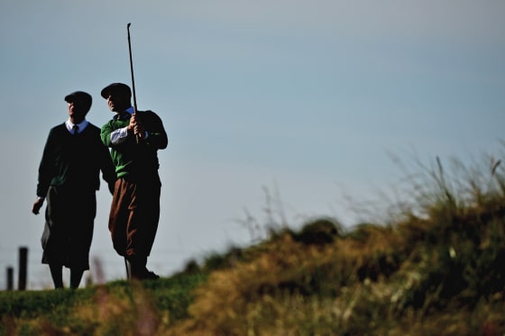 Golfers dressed in 1930s period costume play on Monifeith Links course during the 8th World Hickory Open on Oct. 8, in Monifeith, Scotland.