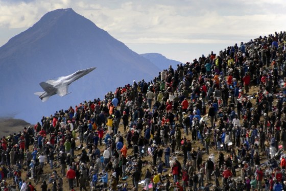 A crowd watches an F/A-18 Hornet fighter aircraft of the Swiss Air Force on Oct. 11 doing a flight demonstration over Axalp in the Bernese Oberland.