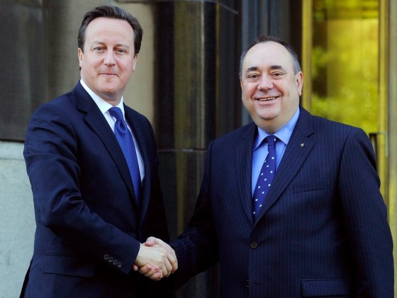 British Prime Minister David Cameron, left shakes hands with Scotland's First Minister Alex Salmond in Edinburgh on Monday.