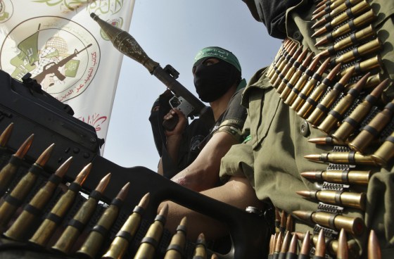 Hamas militants hold weapons during a march in Rafah in the southern Gaza Strip, marking the anniversary of a prisoner swap deal between Israel and Hamas, Oct. 18, 2012. Last year, Israel freed more than 1,000 jailed Palestinians in a swap for Gilad Shalit, an Israeli soldier held in Gaza.