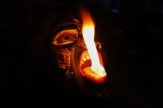 AnIndian performer disguised as Hindu Goddess Kali performs with fire during Navratri festival in Allahabad, India. Navratri or the festival of nine nights is an annual Hindu festival of worship and dance.