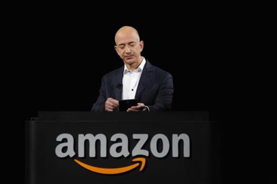 Amazon CEO Jeff Bezos demonstrates the Kindle Paperwhite during Amazon's Kindle Fire event Sept. 6, 2012, in Santa Monica, Calif.