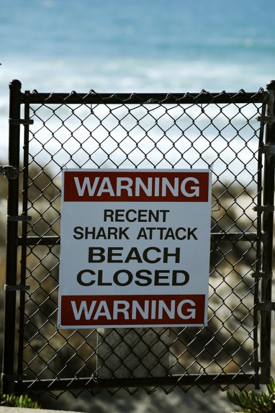 A sign is posted near the beach where a shark attack took place in the waters off of Vandenberg's Surf Beach, near Vandenberg Air Force Base, on Tuesday.