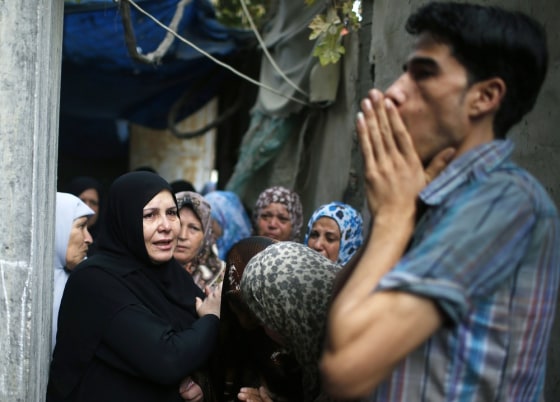 Palestinian relatives of Hamas gunman Ismail al-Tille mourn during his funeral in Beit Lahiya in the northern Gaza Strip on Oct. 24. Raids by Israel on Tuesday killed three members of the Islamist group, one of them al-Tille, in control of the coastal territory. Israel killed another Hamas gunman in its second round of air strikes in as many days on the Gaza Strip on Wednesday, responding to rocket fire at its southern towns that wounded three people.