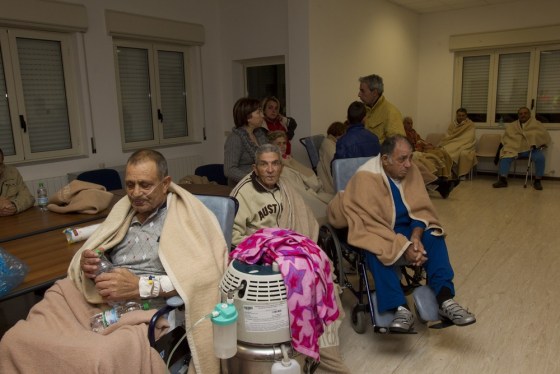 People who had been evacuated from a hospital wait in a rescue center in Mormanno, southern Italy, after an earthquake early on Friday.