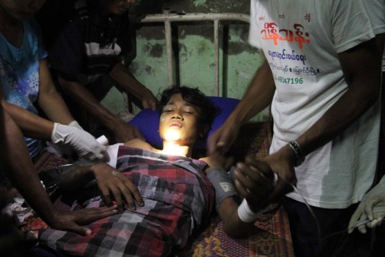 A Rakhine refugee receives medical treatment at Kyauktaw hospital in Kyauktaw, Rakhine State, western Myanmar following renewed ethnic clashes on Oct. 25, 2012.