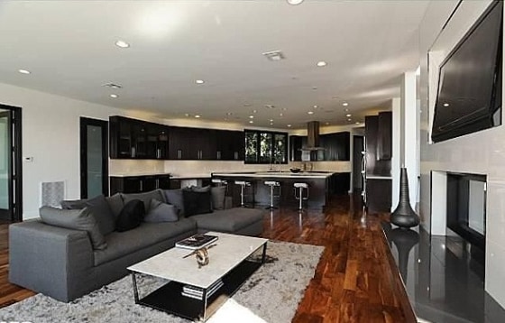 The kitchen in Rihanna' former Beverly Hills home has dual islands, espresso cabinets, granite countertops and stainless-steel appliances.
