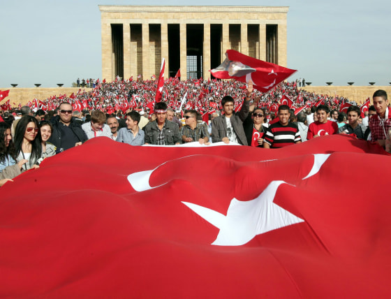 Thousands of people holding national flags gather at the mausoleum of Ataturk to celebrate the country's Republic Day in Ankara, Turkey, Oct. 29, 2012.