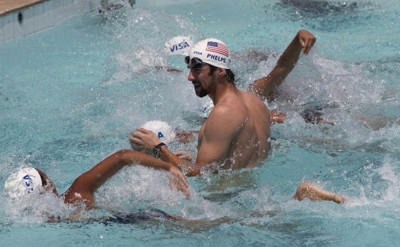 U.S. Olympic swimming champion Michael Phelps trains young swimmers at Olympic Village Carlos Castilho in the Complexo de Alemao slum in Rio de Janeiro, Brazil, Oct. 30.