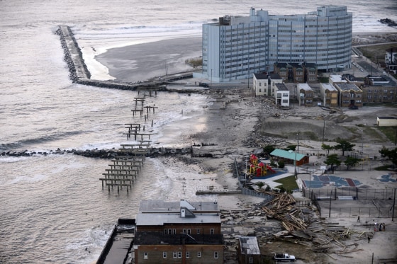 A boardwalk, left, and waterfront property are heavily damaged following Hurricane Sandy in Atlantic City, N.J., on Oct. 31.