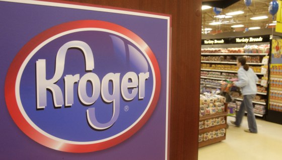 A customer walks down the bread and pastry aisle at a Kroger Co. supermarket, March 1, 2011.