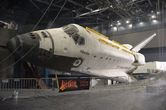 Space shuttle Atlantis is seen fully-exposed, its protective shrink-wrap cover removed, at NASA's Kennedy Space Center Visitor Complex in Florida on Friday.