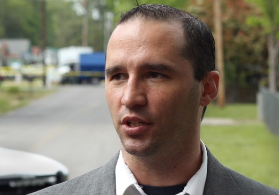 Everett Dutschke speaks to the media as federal officials search his property in Tupelo, Mississippi, on April 23.