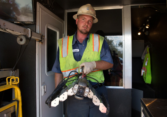 Levi Oleson holds some equipment at his job at Pro-Pipe in Sandy, Utah. Levi Oleson, 26, is back living with his parents at thier home in West Haven, ...
