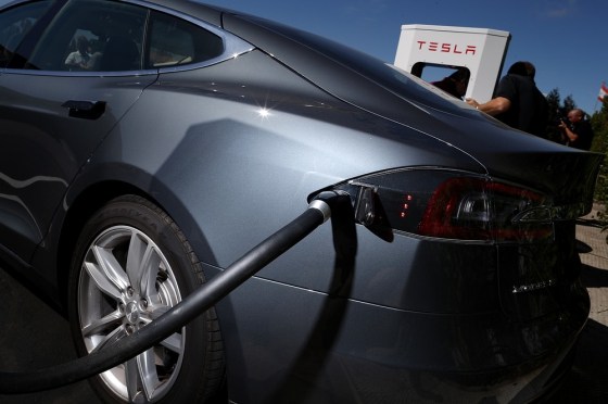 FREMONT, CA - AUGUST 16: A Tesla Model S sedan is seen plugged into a new Tesla Supercharger outside of the Tesla Factory on August 16, 2013 in Fremo...