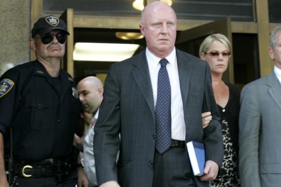 Former Tyco CEO Dennis Kozlowski, center, leaves court with his wife, Karen, right, in New York, Friday, June 17, 2005.