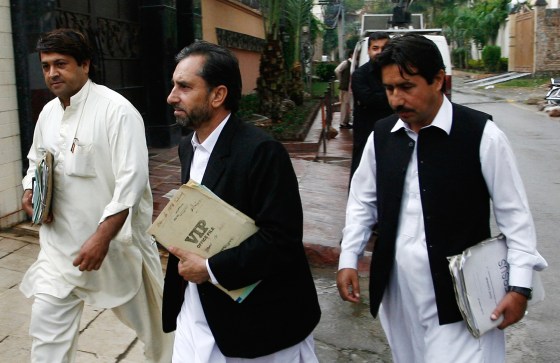 Samiullah Afridi, center, lawyer for doctor Shakil Afridi who ran a fake vaccination campaign to try to help U.S. officials find al Qaeda chief Osama bin laden, arrives in court in Peshawar in October.