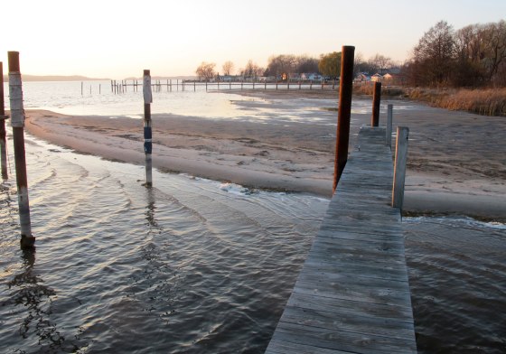 In this Nov. 16, 2012 photo, a sand bar is exposed on Portage Lake in Onekama, Mich., due to low water levels. The waterway is connected by a channel to nearby Lake Michigan where water levels have reached record lows.