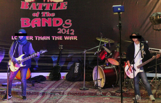 Kashmir's first all-girl rock band Pragaash perform at the annual 'Battle of the Bands' in Srinagar on Dec. 23, 2012. EDITOR'S NOTE: NBC News obscured the faces in this photo to protect the band members' identities because of safety concerns.