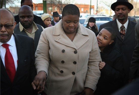 Cleopatra Cowley, arriving with her son Nathaniel for the wake of her 15-year-old daughter Hadiya Pendleton.