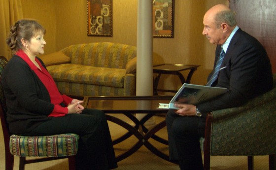 Dr. Phil McGraw is shown with Jennifer Kirkland during a taped exclusive interview to be aired February 13, 2013 in this still image taken from video courtesy of CBS. Kirkland's six-year old son Ethan Gilman was held hostage in an underground bunker for nearly a week by Jimmy Lee Dykes before being rescued by FBI agents.