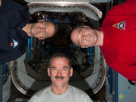 NASA astronaut Tom Marshburn (left), Canadian astronaut Chris Hadfield (center) and space station commander Kevin Ford strike a zero-G pose in the International Space Station's Harmony mode. All three will participate in Friday's Google Hangout.