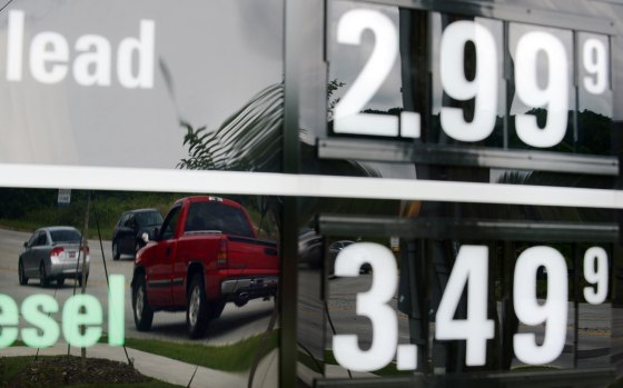 Vehicles are reflected in a sign advertising unleaded gas for $2.99 at a QuikTrip station at the corner of Woodruff Rd. and Verdae Blvd. on Monday, Ju...