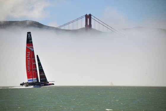 Team Emirates sails their AC-72 Racing Yacht by the Golden Gate Bridge as they test out the course in preparation for the upcoming America's Cup compe...