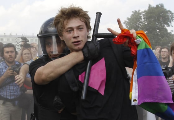 Police detain a gay rights activist during a Gay Pride event in St. Petersburg on June 29, 2013.