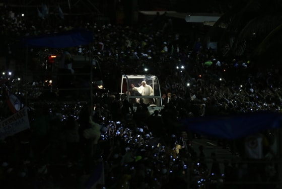 Pope Francis greets the faithful as he arrives at Copacabana Beach to celebrate mass on his sixth day in Rio de Janeiro, July 27, 2013.