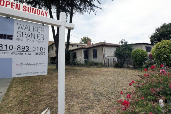In this Tuesday, June 11, 2013, photo, a single house is offered for sale in Santa Monica, Calif.