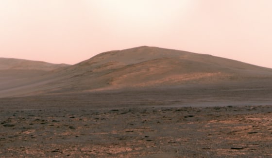 This panorama from NASA's Opportunity rover, made on June 1, shows Solander Point rising up on the Martian horizon. Mission managers plan to get the solar-powered rover to a north-facing slope on Solander Point by August, so that it can shelter there during the Martian winter.