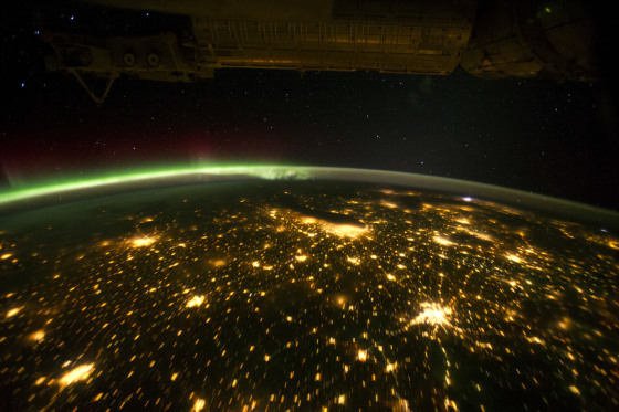 This greenish auroral display was seen from the International Space Station on Sept. 29 as the orbital outpost was passing over the American Midwest. The city lights of Omaha, Des Moines, Minneapolis/St. Paul, Chicago and St. Louis are visible below.