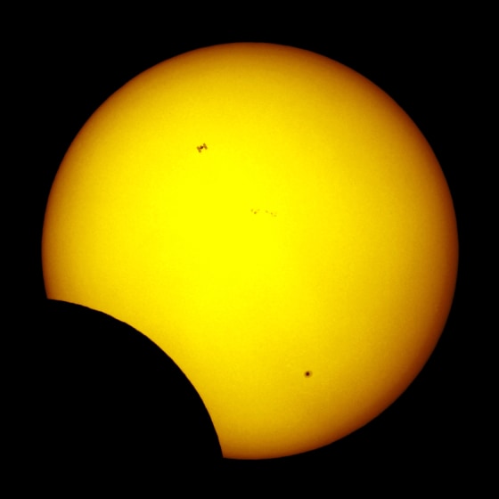 Belgian astrophotographer Thierry Legault's picture of Tuesday's partial solar eclipse also shows the International Space Station passing over the sun's disk.