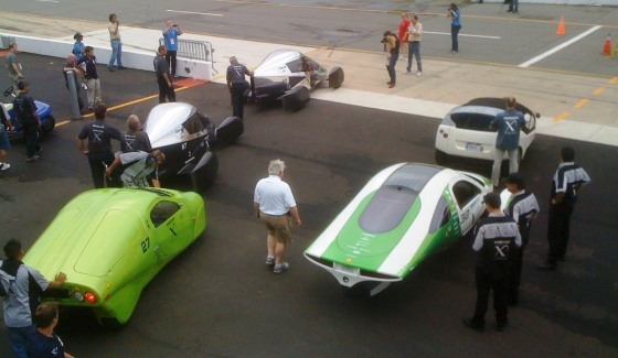 Contenders for the Progressive Insurance Automotive X Prize get set to take to the track during the finals at the Michigan International Speedway. Counterclockwise from top are two of the Edison2 Very Light Cars, Li-On Motors' Wave II, the Aptera 2e and the TW4XP alternative vehicle.