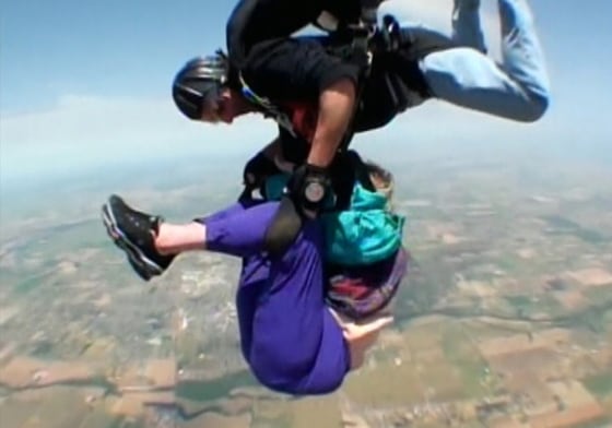 Laverne Everett's skydiving partner holds onto her after she fell out of her harness.