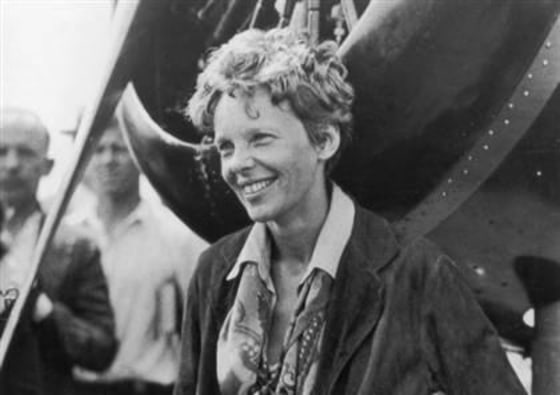 Amelia Earhart exits her aircraft at Derry, Ireland, after her solo transatlantic flight in 1932.