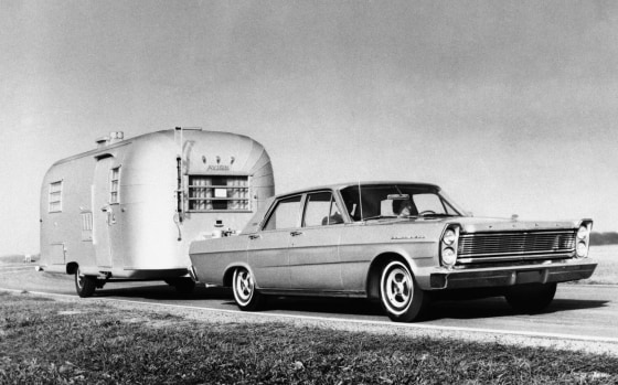 Ford Mustang with travel trailer.