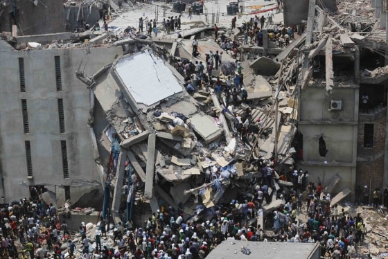 People rescue garment workers trapped under rubble at the Rana Plaza building after it collapsed, in Savar, 30 km (19 miles) outside Dhaka in this Apr...
