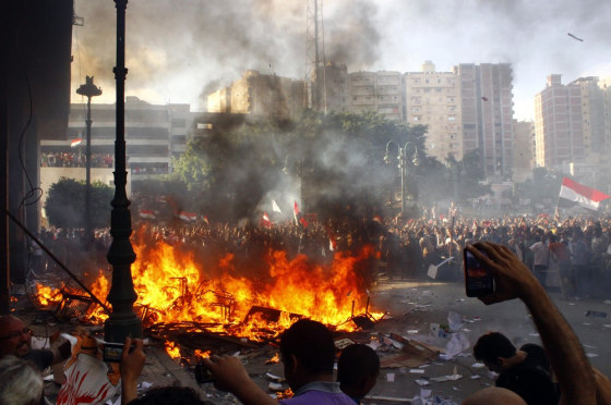 Opponents of Egyptian President Mohamed Morsi burn a Freedom and Justice Party office Friday in Alexandria, Egypt.